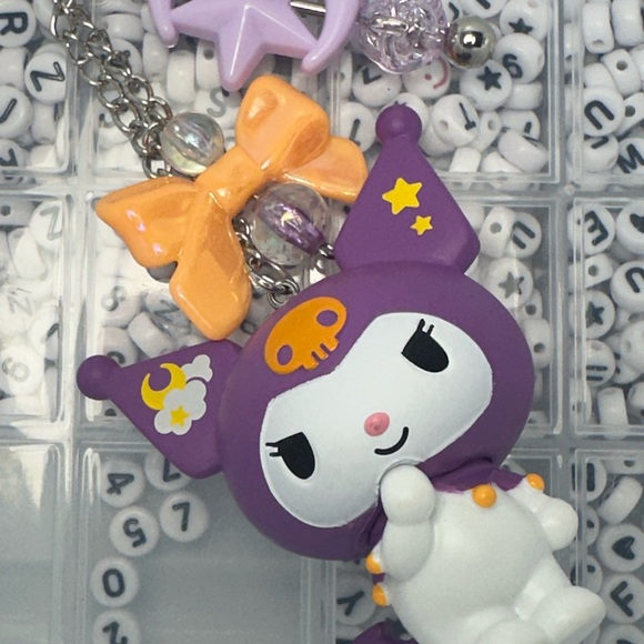 Cute Hello Kitty Character Keychains with Purple and Orange Accents - Picture 5 of 7